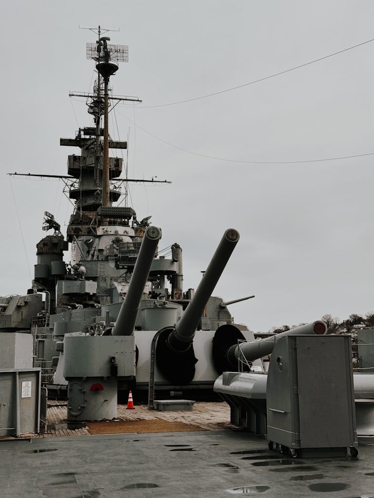 Historic USS Alabama battleship with visible artillery guns on deck.