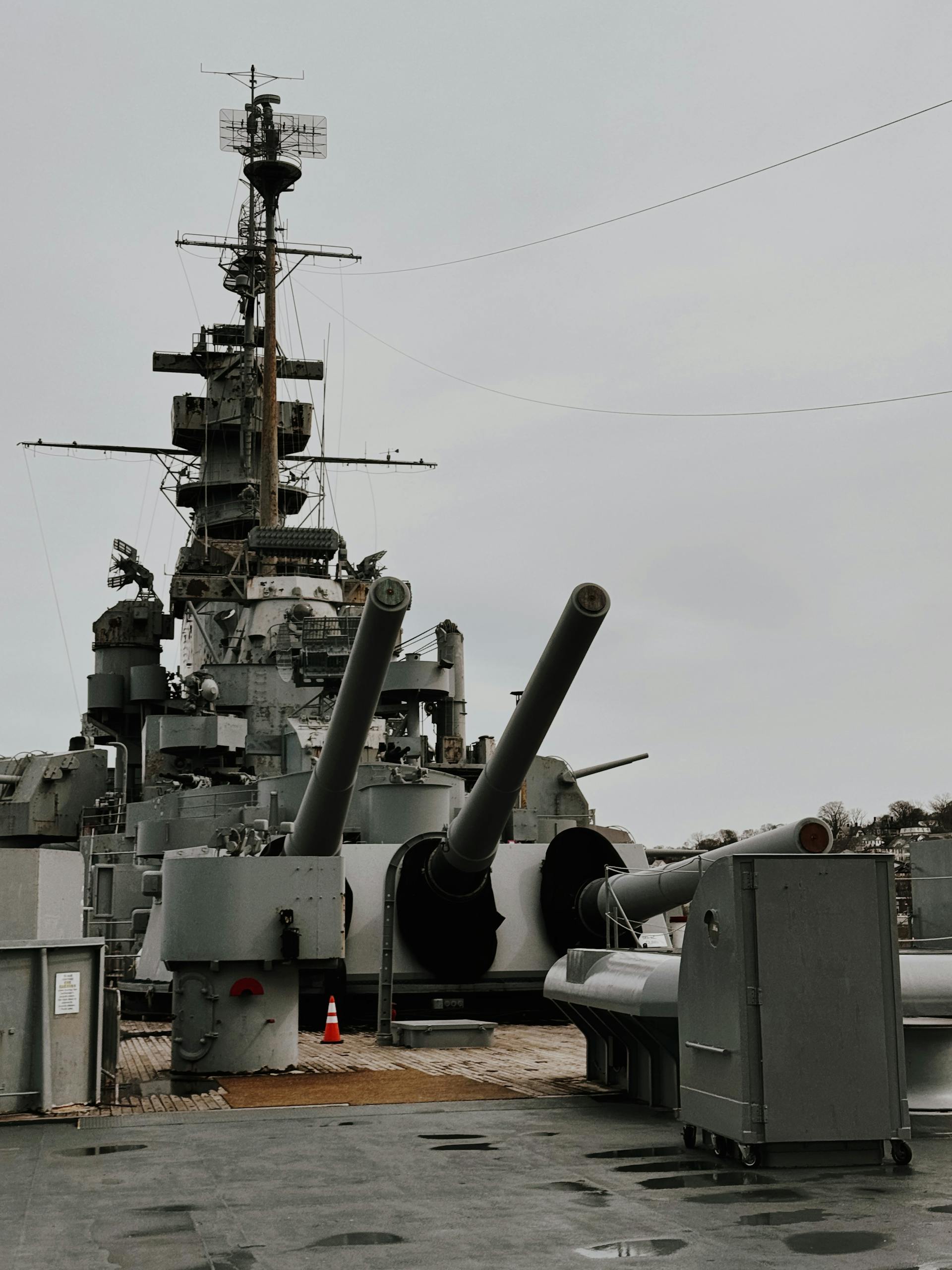 Historic USS Alabama battleship with visible artillery guns on deck.