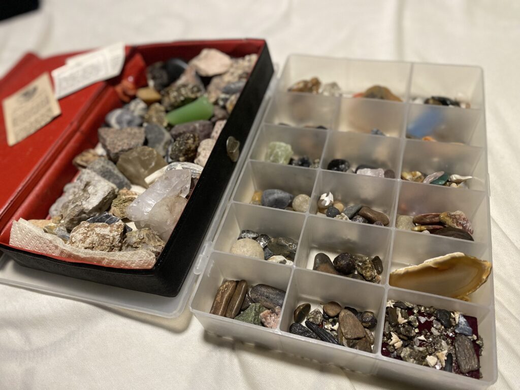 two small containers full of rock from a childhood collection